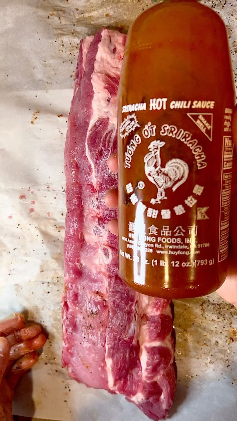 Sriracha is the slather of choice. Rubbed with 2:1 pepper and salt, garlic, onion, cayenne, chili, paprika. #smoke #ribs…