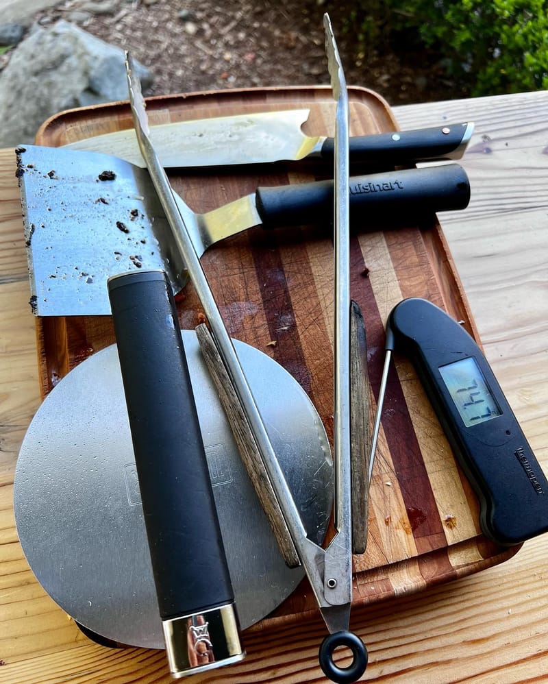 My burger arsenal…the Weber smasher is big and sturdy, tongs I’ve had for many years for onions, knife to get cross section…