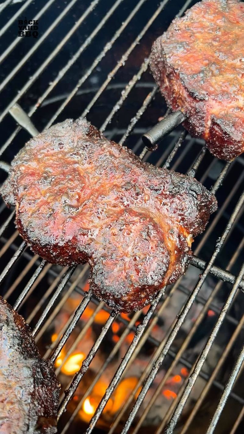 Here’s part two of the pork steak cook. Cook them over direct heat at 275 until the crust forms and mop with a thin mustard…