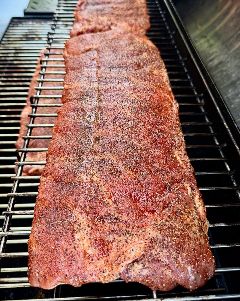 What’s on your smoker? Mine?… 3 racks of St. Louis ribs. No trim. No binder. REO Black pepper and Seasonall. Super fast…