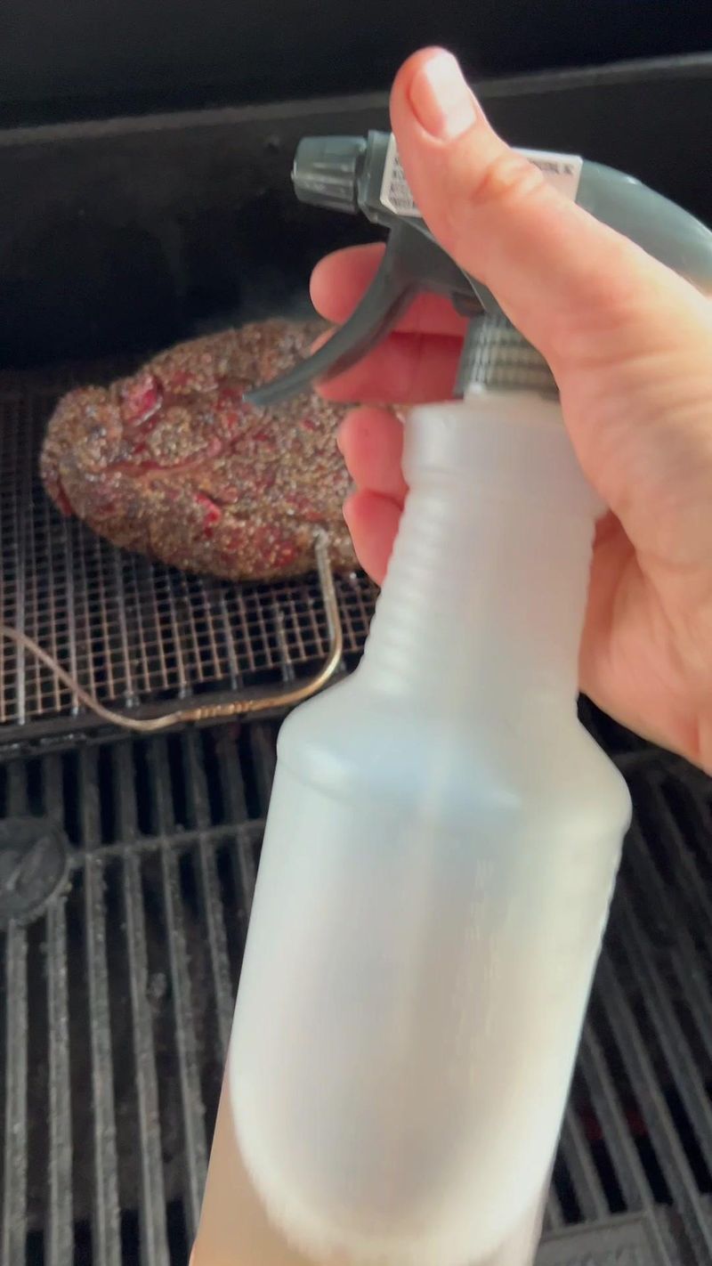These dollar store spray bottles work great for spritzing your meat. 50:50 ACV:h2o #bbq #bbqhacks #dollartree