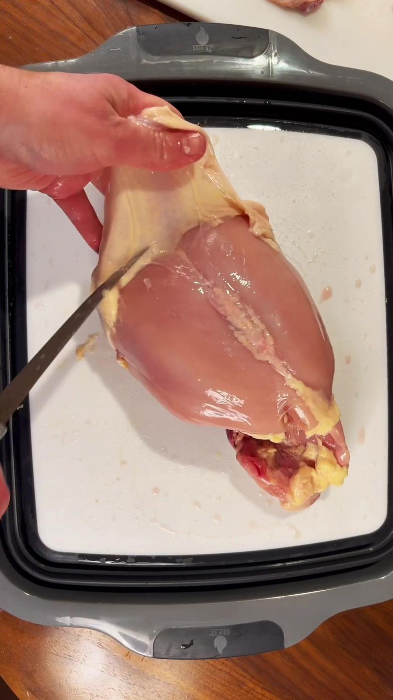 How to cleanly remove chicken breast skin #kitchentip #chicken #knifeskills #bbq #howto #learnontiktok