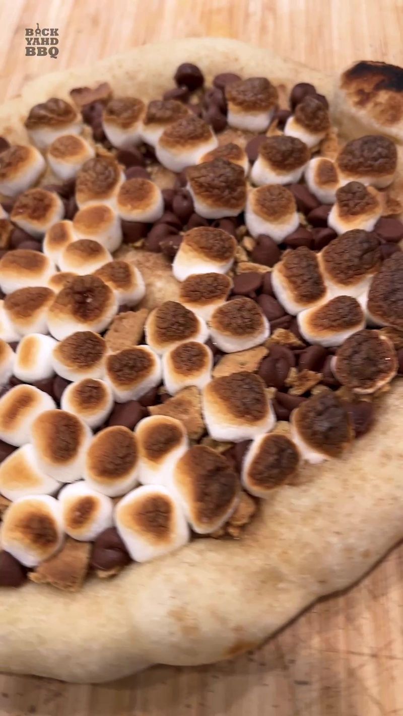 We hadn’t planned on making smores pizza, but after making 15 regular pizzas, we had 3 dough balls left and needed more…