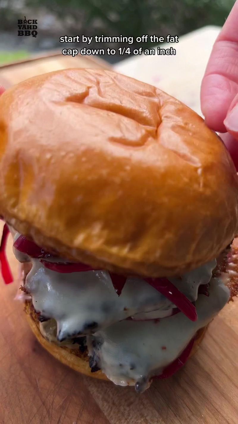 Let’s make brisket smash burgers. Trim the fat cap down to a quarter of an inch and round off the corners. Flip it over and…