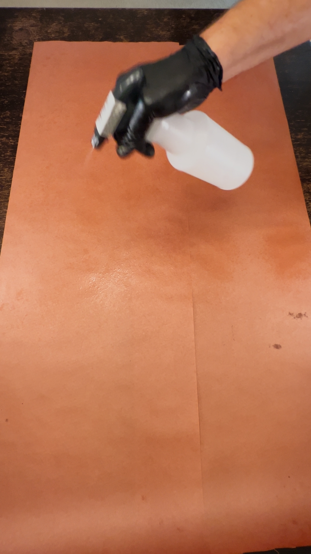 Spritzing paper with water